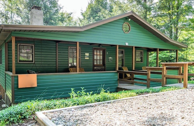 Relax on the covered porch at "J.C.'s Bunkhouse" at Lake Mokoma