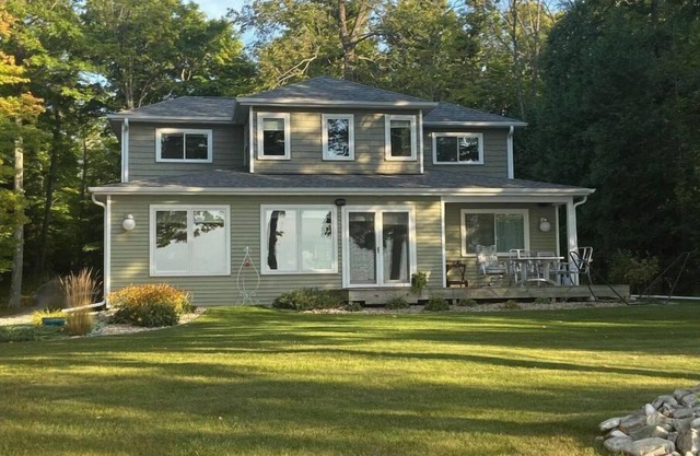 Relax on the shores of Green Bay in your beautiful, private, two bedroom home