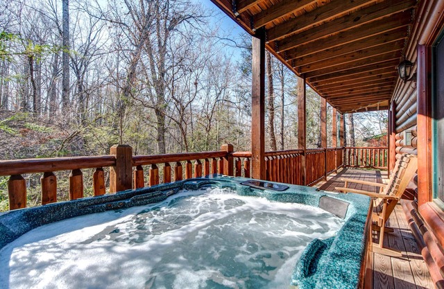 Relaxing Wooded Views with a Hot Tub and Pool Table for Ultimate Comfort