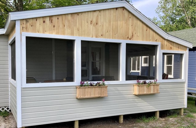 Remodeled lakefront cottage w/marina, firepit, swimming area.