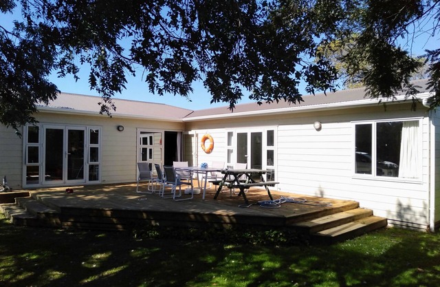Renovated oasis with large deck and leafy privacy