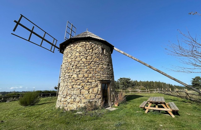 Restored windmill with countryside view