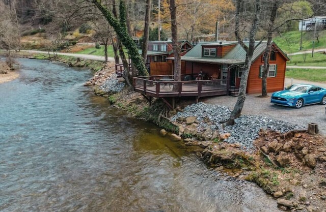 Riverfront Cabin with Deck and Fire Pit Near the Smoky Mountains!