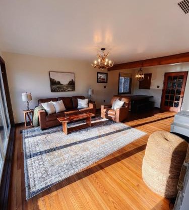 Riverfront cabin with hot tub, kayaks, dock, dog ok
