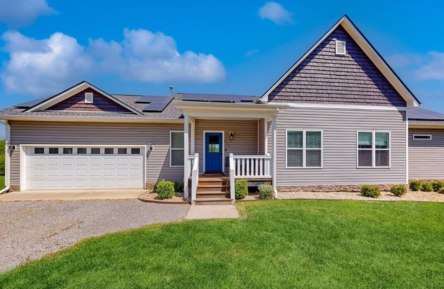 Riverfront, dog-friendly home with large property, playhouse, firepit & den