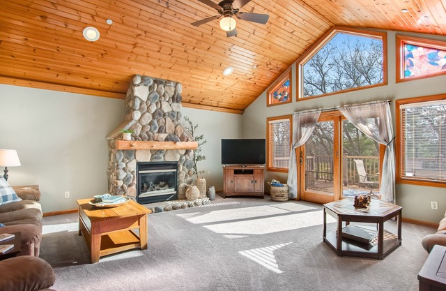 Riverfront golf resort condo with pool, hot tub, volleyball, & fairway-view deck