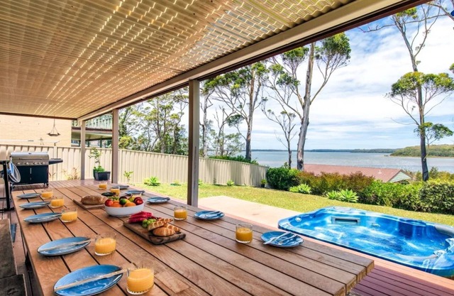 Sandy C - immaculate modern home with outdoor spa and stunning lake views.