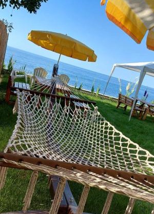 Seafront Apartment by the sea and with a beach and with big garden