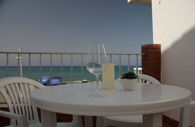 Seafront fisherman's cottage with ample terrace overlooking the Mediterranean.