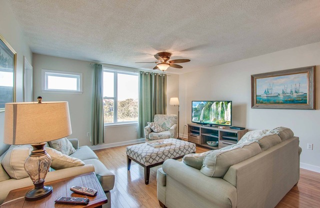 Second-floor condo with river views and access to a community pool