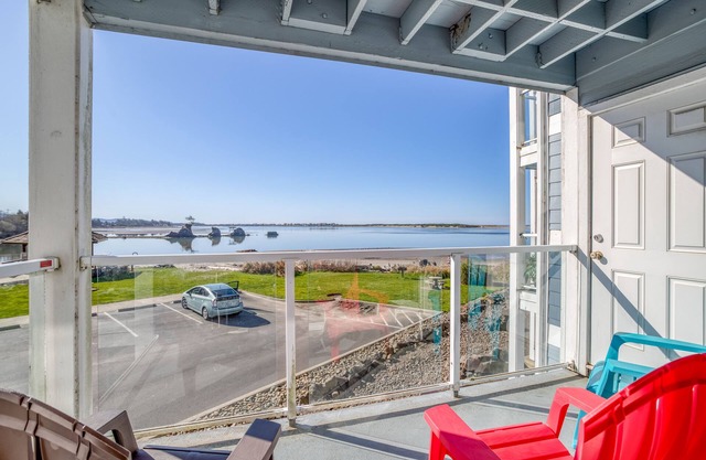 Second-Story Views of the Pacific and Siletz Bay in this Waters Edge Condo