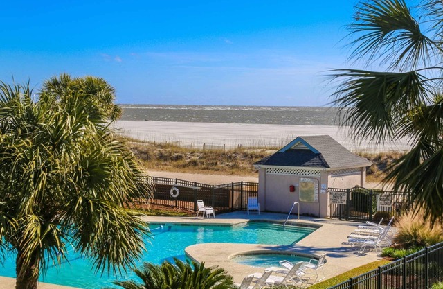 See, Feel & Hear the Ocean from this Light-Filled Condo w/Community Pool & Private Screened Porch.