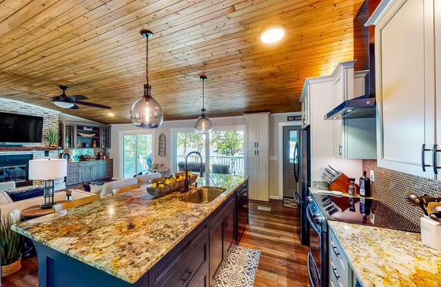 Serene lakefront retreat with dock, firepit, furnished deck, gazebo & boathouse