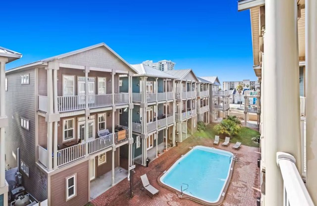 Serenity by the Sea! 4BR Retreat, Sleeps 12, Walk to Beach & Community Pool