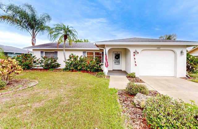 Single-story home with private yard, enclosed patio, updated interior, & W/D