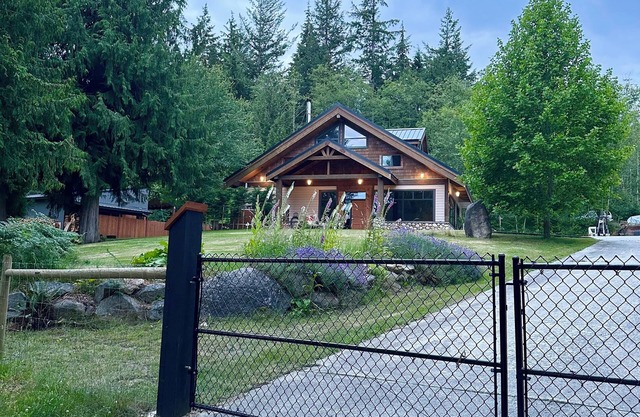 "Sleeps 15: Dog-Friendly Rustic Haven on Cortes Island" Large grass yard