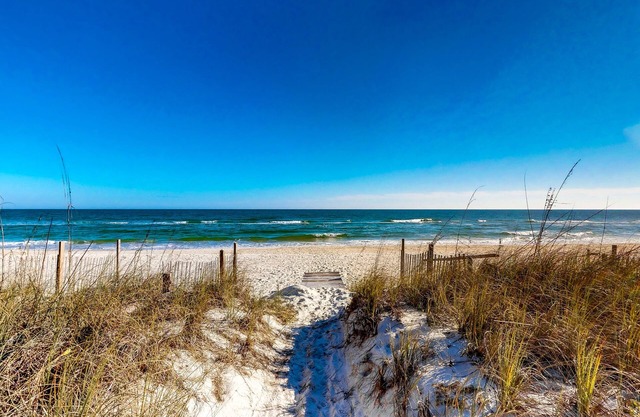 Snowbird-friendly beachfront home with a pool, tennis, washer/dryer, fireplace