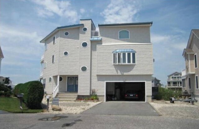 Spacious bayfront home in Avalon Manor with spectacular 360 degree views of the wetlands and inlet from the roof top deck.