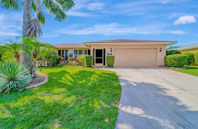 Spacious lakeside home with modern kitchen, heated pool, and central AC