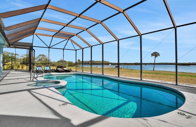 Sprawling intercoastal home with boat lifts, pool and hot tub