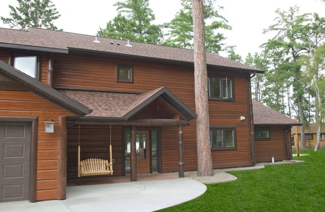 Spruce with two story high windows with loft on the premier lake of Big Sand