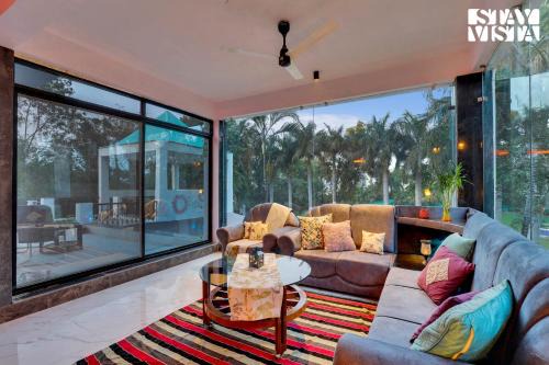 StayVista's Palm Perle Villa - Pet-Friendly Retreat with Terrace, Lawn & Pool Table