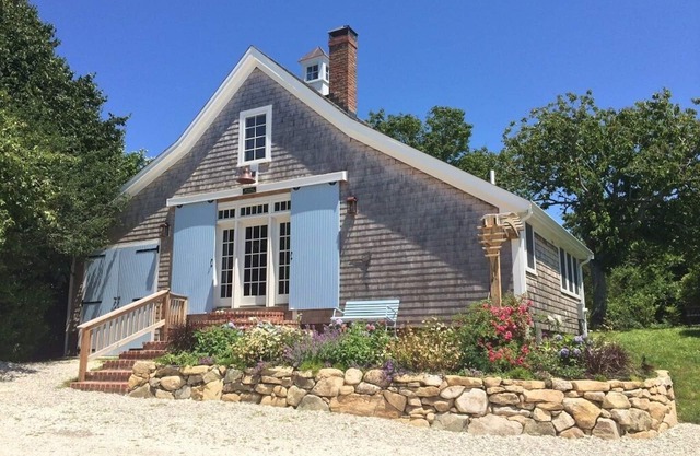 Step back in time in this beautifully maintained antique horse barn cottage!