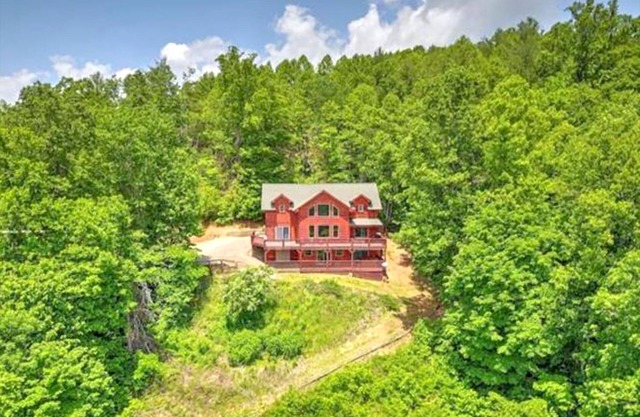 Still Waters Log Cabin Sits in a Mountain Lake Setting. Amazing Views!