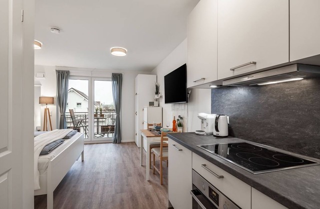 Studio apartment with large balcony and stylish furnishings near the harbor.