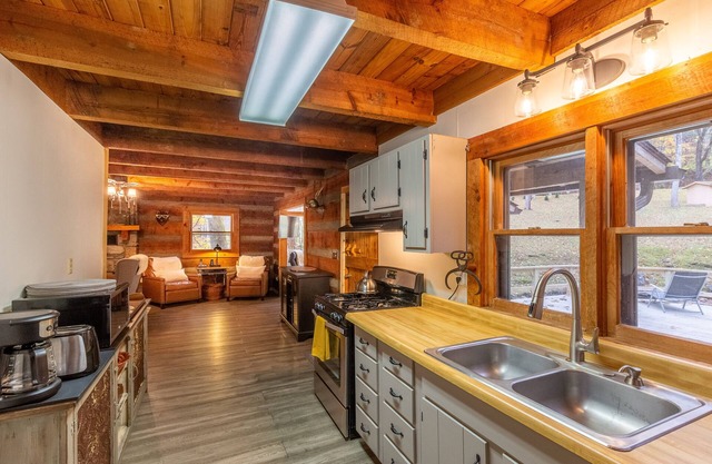 Stunning water-view cabin with fireplace, sunroom, deck, firepit, & fast WiFi