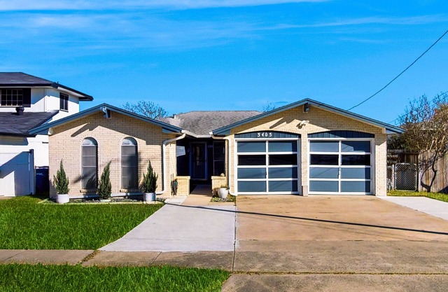 Stunning waterfront home on the canal with large yard & covered patio