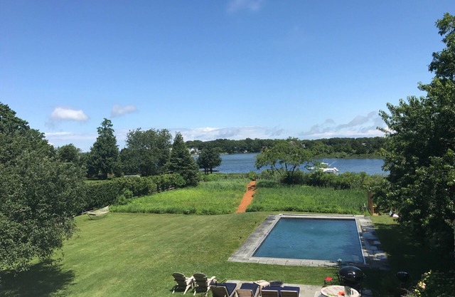 Stunning Waterfront 4 Bedroom Home with Pool, a Dock, an Acre of Land & a Boat