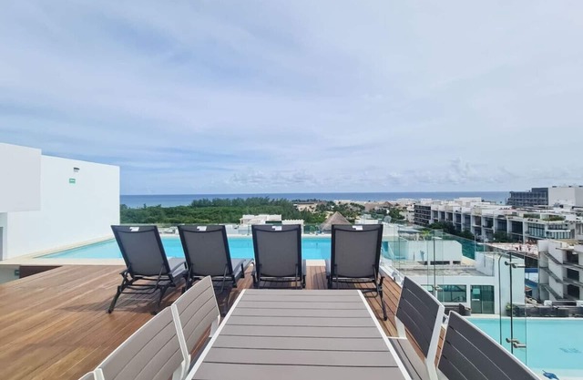 Stylish 1BR | Private Balcony + Rooftop with Sea View