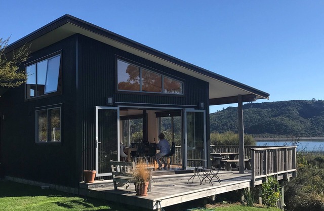 Stylish estuary-front bach