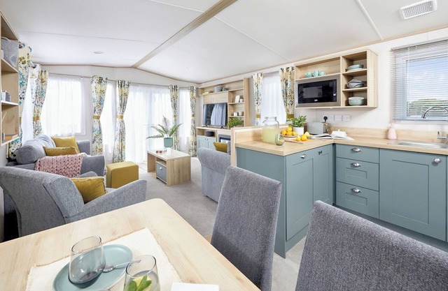 Stylish with a touch of luxury 12ft-wide caravan with one double and two twins.