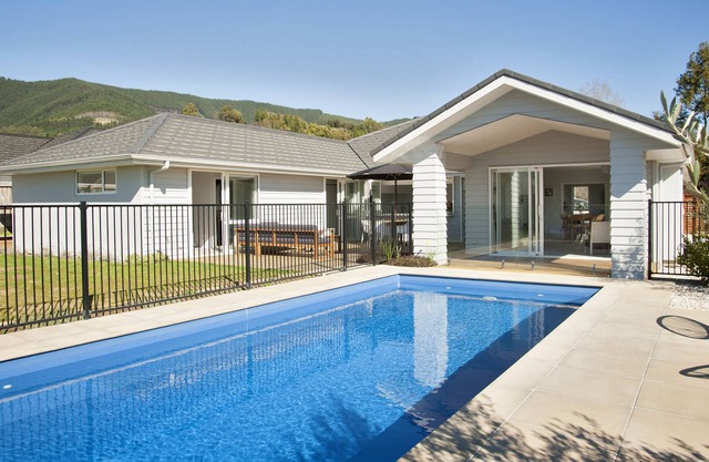 Sunny & spacious modern home with heated swimming pool.