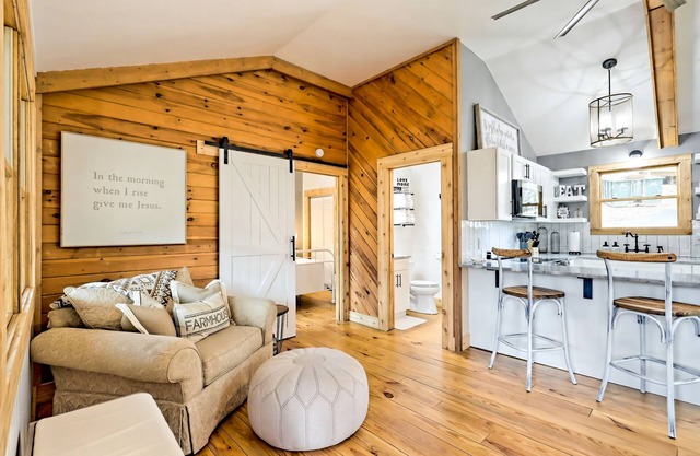 The Coop | Woodland cabin in Blairsville with wraparound porch & fireplace