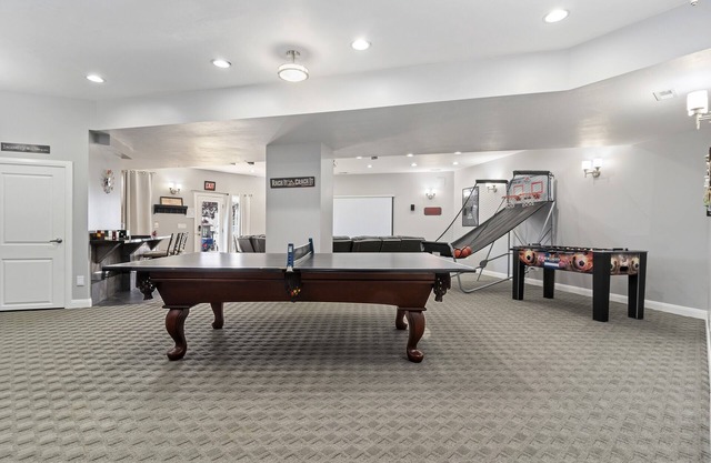 The Rec Room is a basement apartment with game tables, theater, hot tub & more!