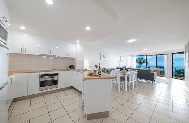 This 2-bedroom unit offers sea views just steps away from Airlie Main Street