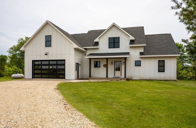 This new construction Modern Farmhouse Style home