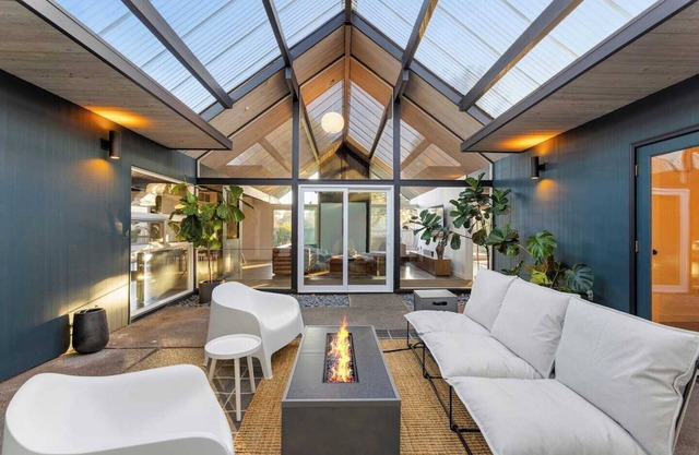 This Robert Rummer masterpiece celebrates mid-century design and A. Quincy Jones’ iconic “double gable.” Soak in natural light from the atrium, relax under vaulted ceilings, and retreat to your private hot tub where style and serenity meet.