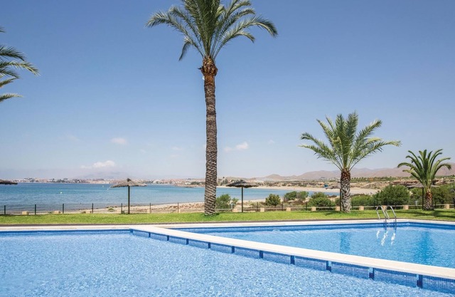 This vacation apartment with modern equipment offers a magnificent view of the sea and the huge pool
