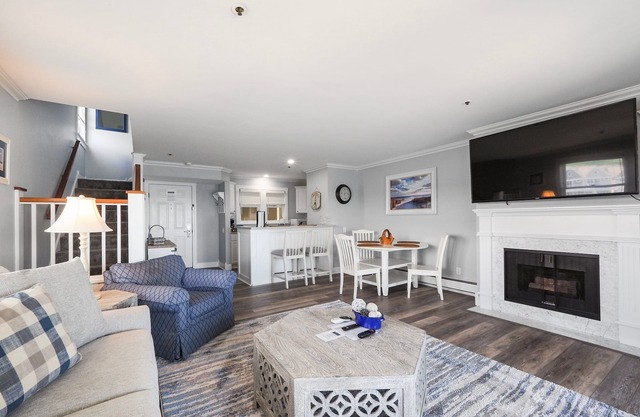 Top-Floor Lake Charlevoix Condo | Private Beach Access | Gas-Log Fireplace