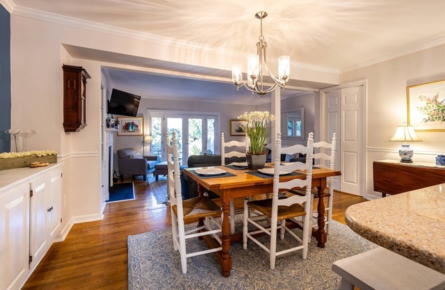 Townhome steps from Main St. with private backyard patio & parking