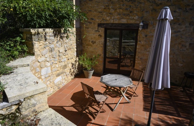 Traditional stone cottage in rural setting with direct access to poolside