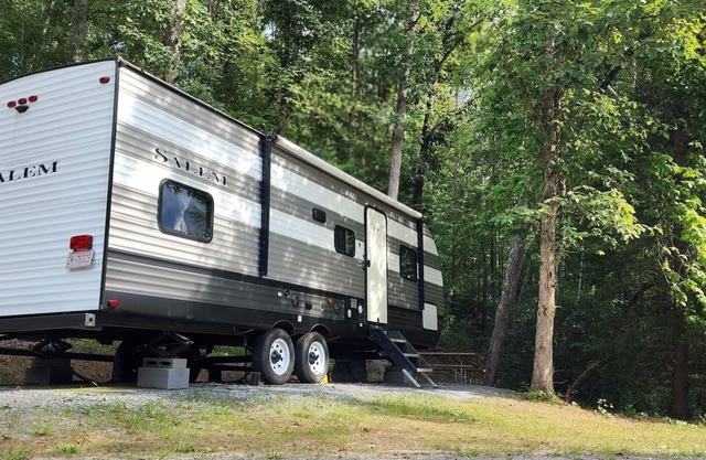 Travel trailer near the creek, short walk to pool and playground, sleeps 8.