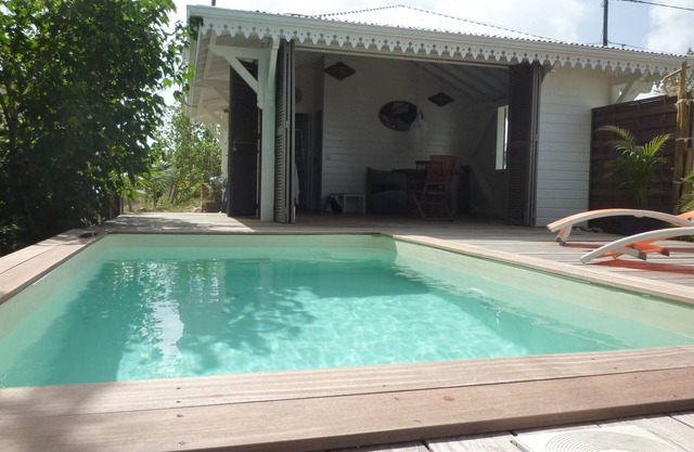 Two bungalows set in tropical gardens with private pools and sea views