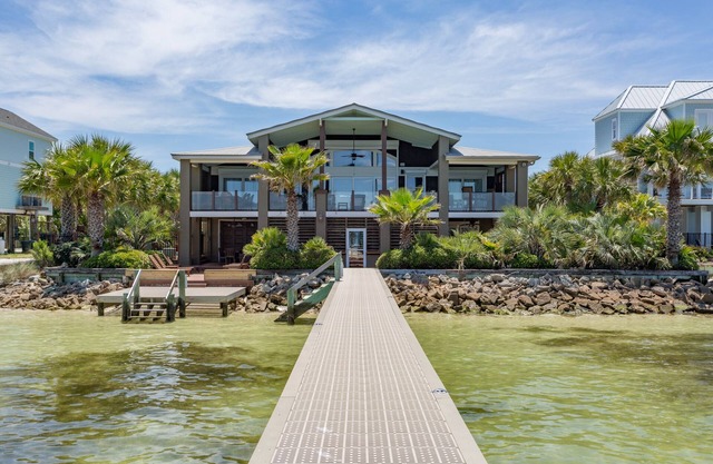 Two kitchens, 2 living areas, 5 beds, 4 baths & game room! Soundfront pool