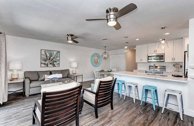 Two minute walk to beach! PRIVATE HEATED POOL w covered lanai. Great location!
