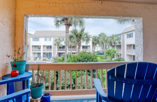 Two-story condo with balcony, WiFi, W/D, AC, 2 pools, & tennis - steps to beach